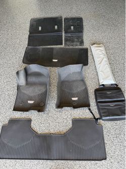 Takeoff 2023 Escalade All Weather Floor Mats, branded sunshade, and back of seat caddy