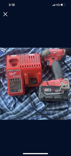 Milwaukee Impact And Charger 