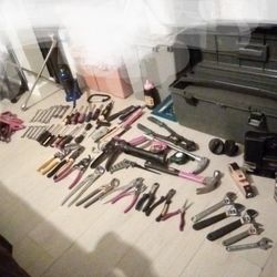 Assorted Tools,Tire Iron, Jumping Cables, Car Vacuum,Tool Box , Vice Grips , Channel Locks, Wrenches,Hammer, Phillips And Flathead Screw Drivers ,