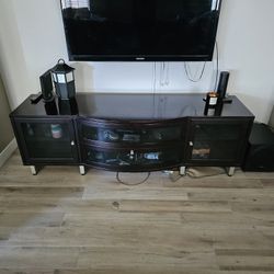 Dark Brown To Black Tv Stand With Glass Panles And Sliver Legs