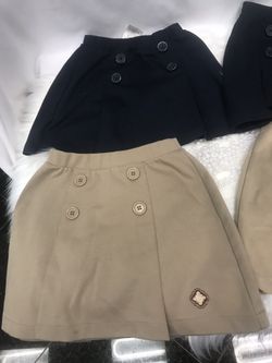 Francis Parker uniforms skirts two in navy blue and two in a light brown plus a navy blue pants all size 6:7 in very good condition