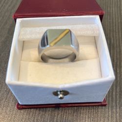 Men’s Stainless Steel with 14K yellow gold accent. Size 10 1/2. Heavy ring excellent condition