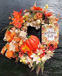 Fall grapevine wreath with pumpkin and welcome fall