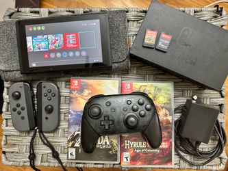 Nintendo Switch 1 with 2 Zelda game packs and gamepad