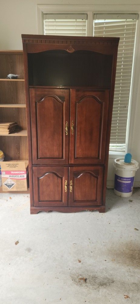 Beautiful Armoire With Glass Shelves And Mirror Backsplash