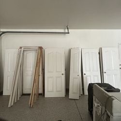 23 Interior Doors , Closest Doors,  Two Steel Garage Doors 