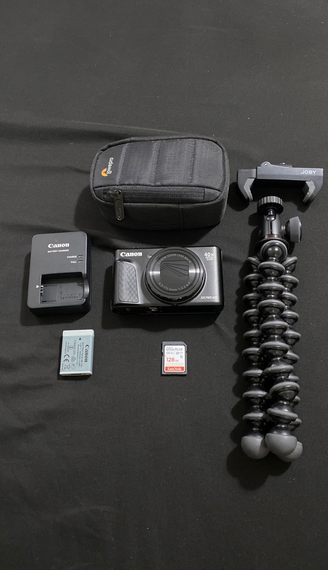 Canon SX740 HS camera with 1 battery with charger, Ultra PLUS 128 GB SanDisk SIM card, Joby gorilla tri-pod, and Lowepro camera bag