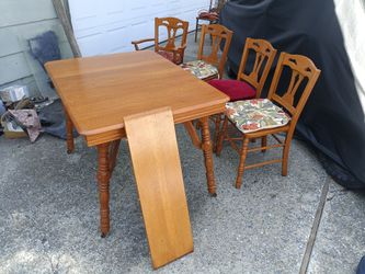 Solid wood 46"x34" kitchen table with 10" leaf & four chairs