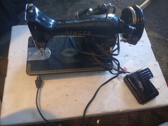 Antique Singer sewing machine with lights and pedal