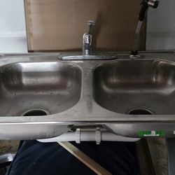 Double Sink With Faucet And Connecting Pipes