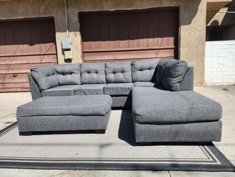 Grey Living Spaces Sectional Couch with Ottoman