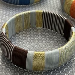 Wide textile bangle bracelets, $12 each, Cara N.Y., Nordstrom