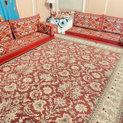 Arabica couch on the floor (if you buy this I will give you the red rug under it