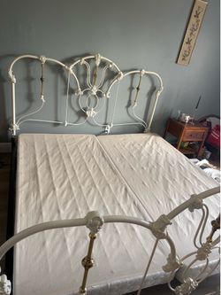 Metal and brass king bed frame