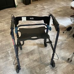Walker with folding seat 