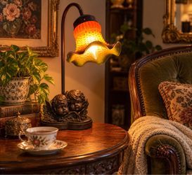 Vintage Art Nouveau–Style Cherub Lamp – Amber Floral Glass Shade – $95