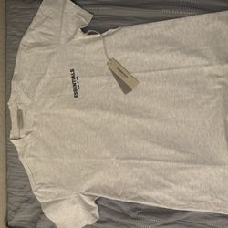 Light oat meal fear of god essentials T shirt 