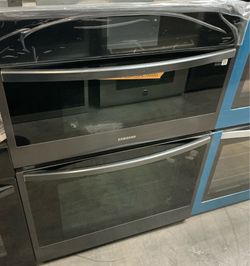 New Samsung 30 cu ft Electric Wall Oven and microwave Combo in Black Steel  with steam cook