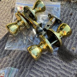 Pair Kwikset Passage Knobs and one locking bathroom knob set
