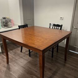 Extendable wooden dining table with chairs