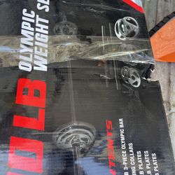 New in box Olympic bar with weight plates