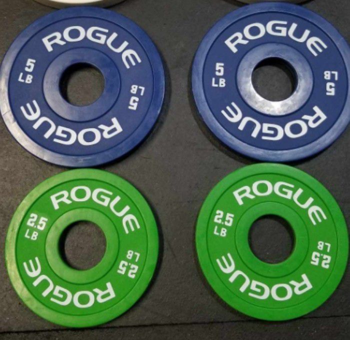 Pair Of Rogue 5 Pound Change Plates And 2 Pairs Of Rogue 2 1/2 Pound Change Plates 