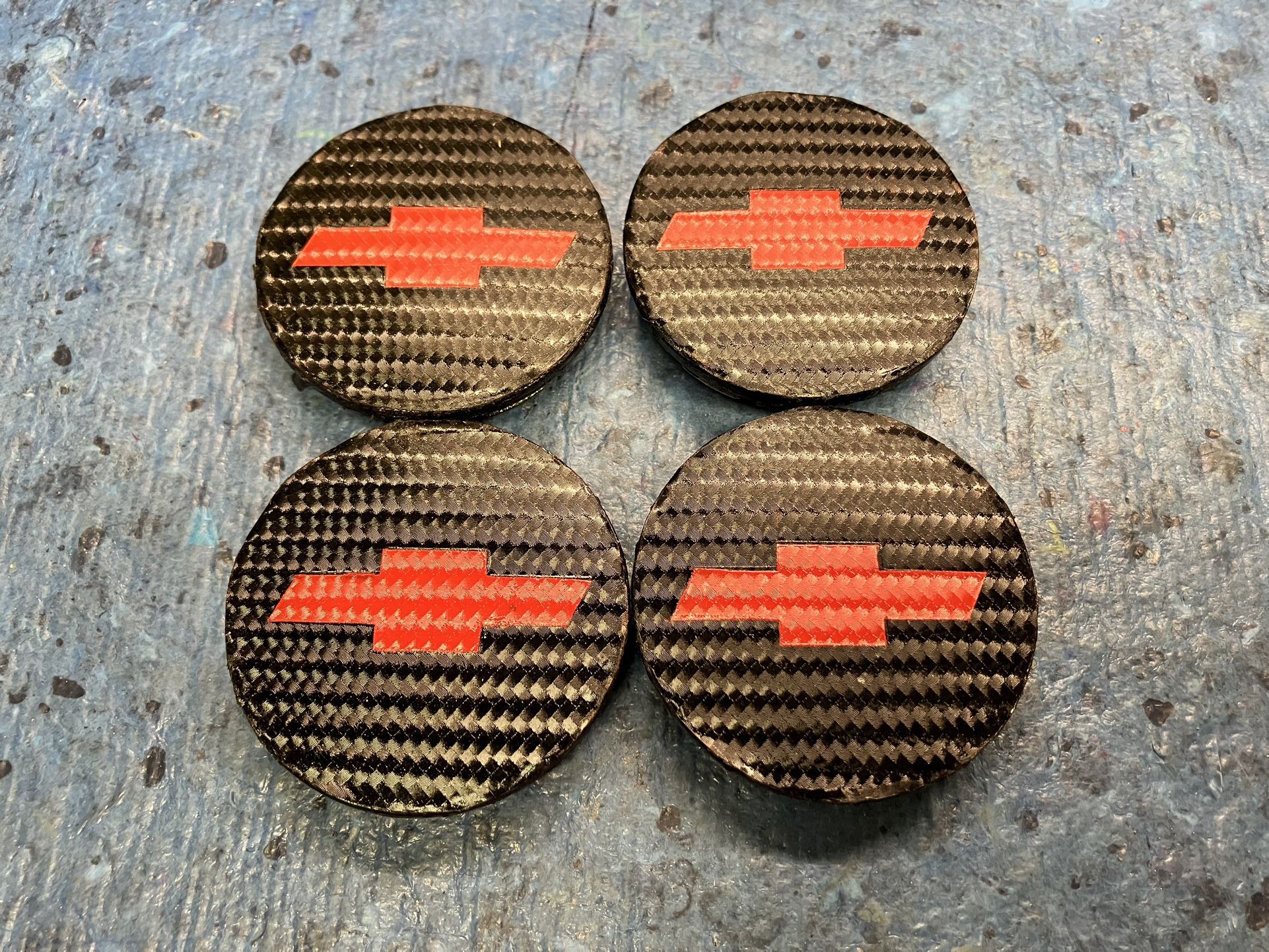 Chevy 2” carbon fiber red emblem rim center cap set.
