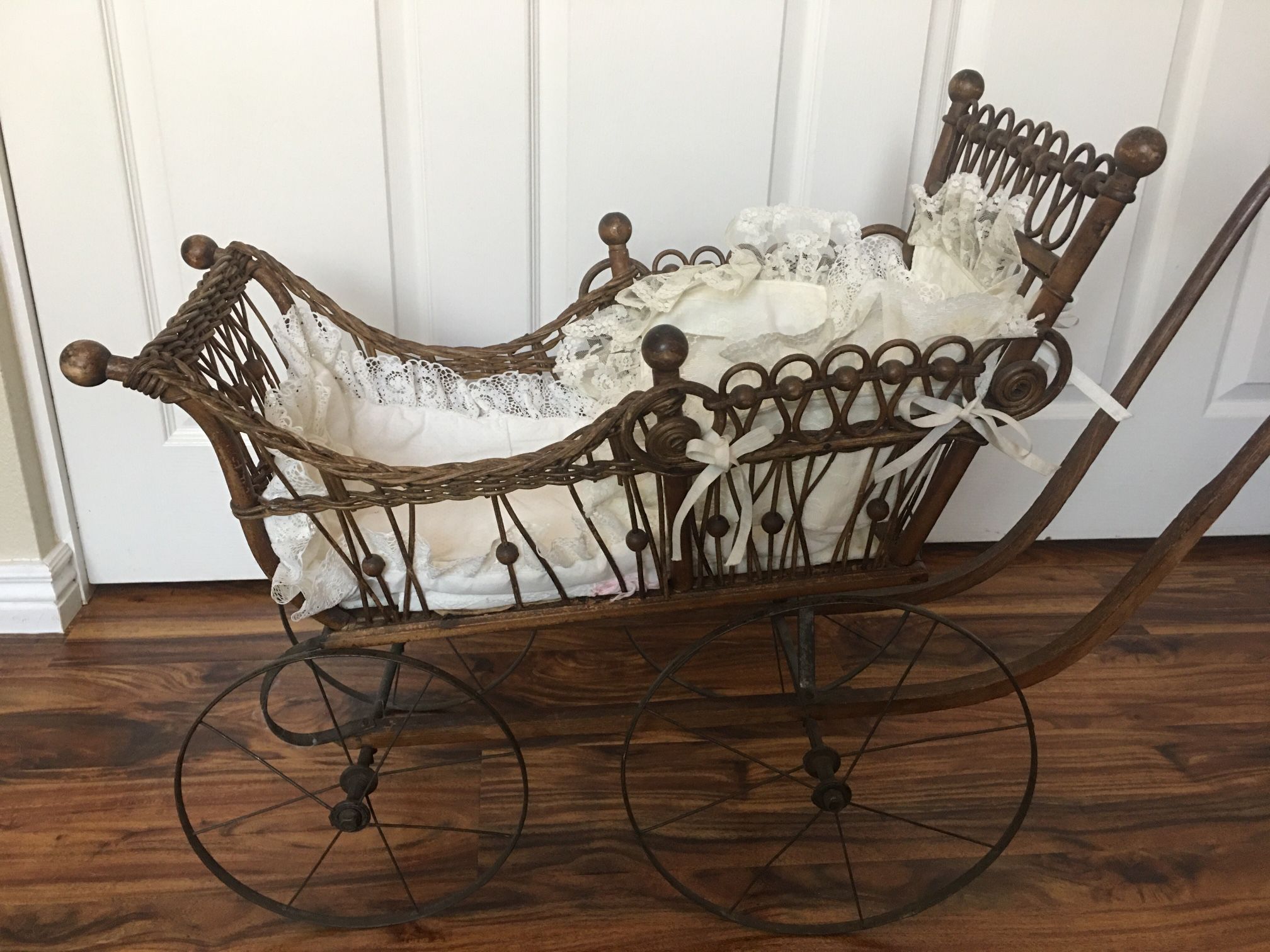 Antique stroller with baby doll