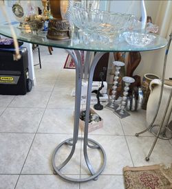 Hightop Glass Table Chrome modern contemporary
 42.5h x 36w

2 Barstool Seats steel chrome Contemporary Modern
31h x 18w

sleek modern style to your k