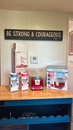 Nostalgia cotton candy machine with sugar an cones