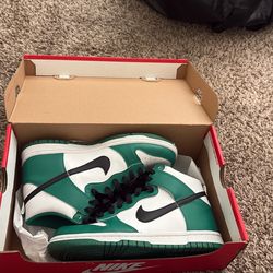 High top green dunks.