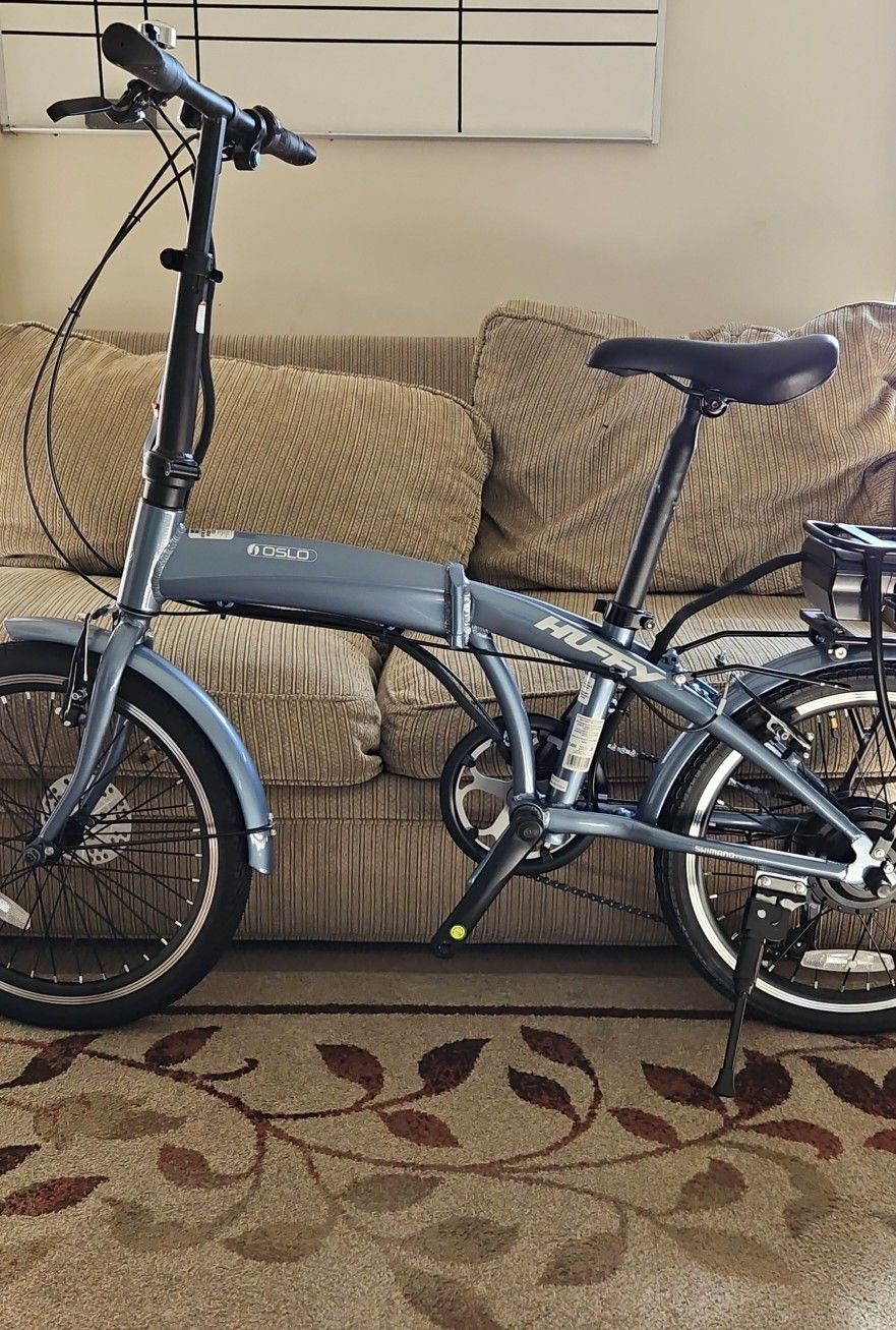 Huffy Oslo 36 Volt Folding E- Bike 25 Mi Operating Range 20 MPH Max Speed- Charcoal