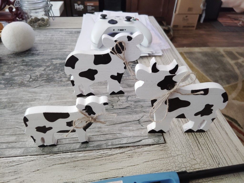 Family Of Wooden Cow Figurines