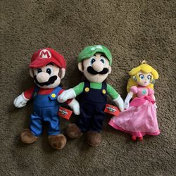 Mario, Luigi, and Princess Peach Plushies from Super Nintendo World 