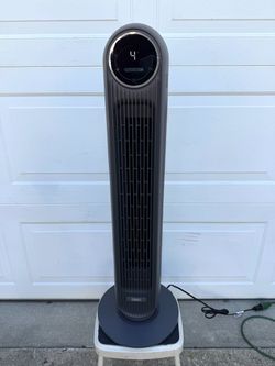 Dreo brand upright tower fan, model DR-HTF007, with a power of 42W. Touchscreen control panel, multiple speed settings, automatic swivel, timer, and a