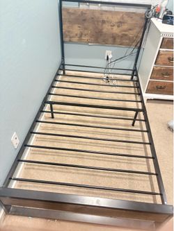 Twin bed frames, 2 total. Great condition. Black and Brown.