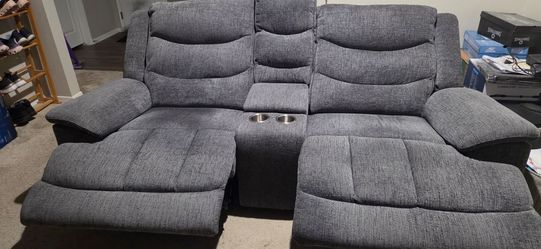 Reclining sofa with plug in for phone