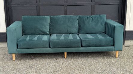 Dark green velvet sofa