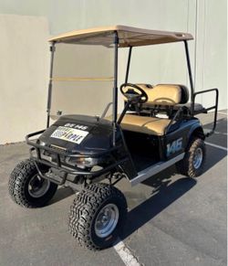 2002 EZ-GO TXT PDS 4-Passenger Lifted 36-Volt Golf Cart