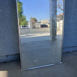 Restroom cabinet with mirror