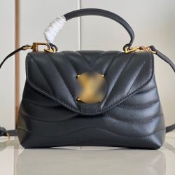 Leather handbag with a crossbody strap

