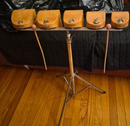 vintage set of five temple blocks mounted on a specialized tripod stand.