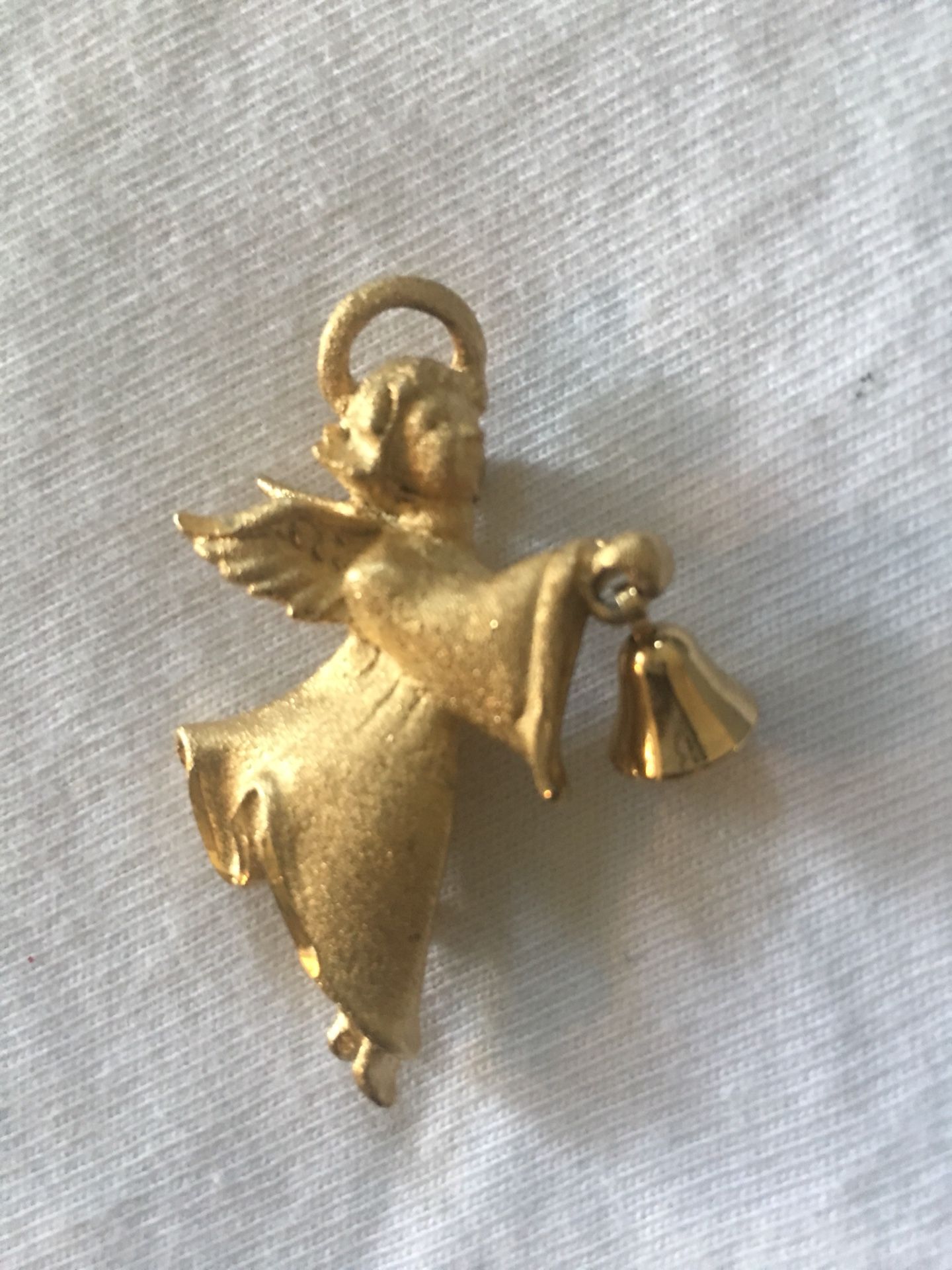 Angel with bell brooch