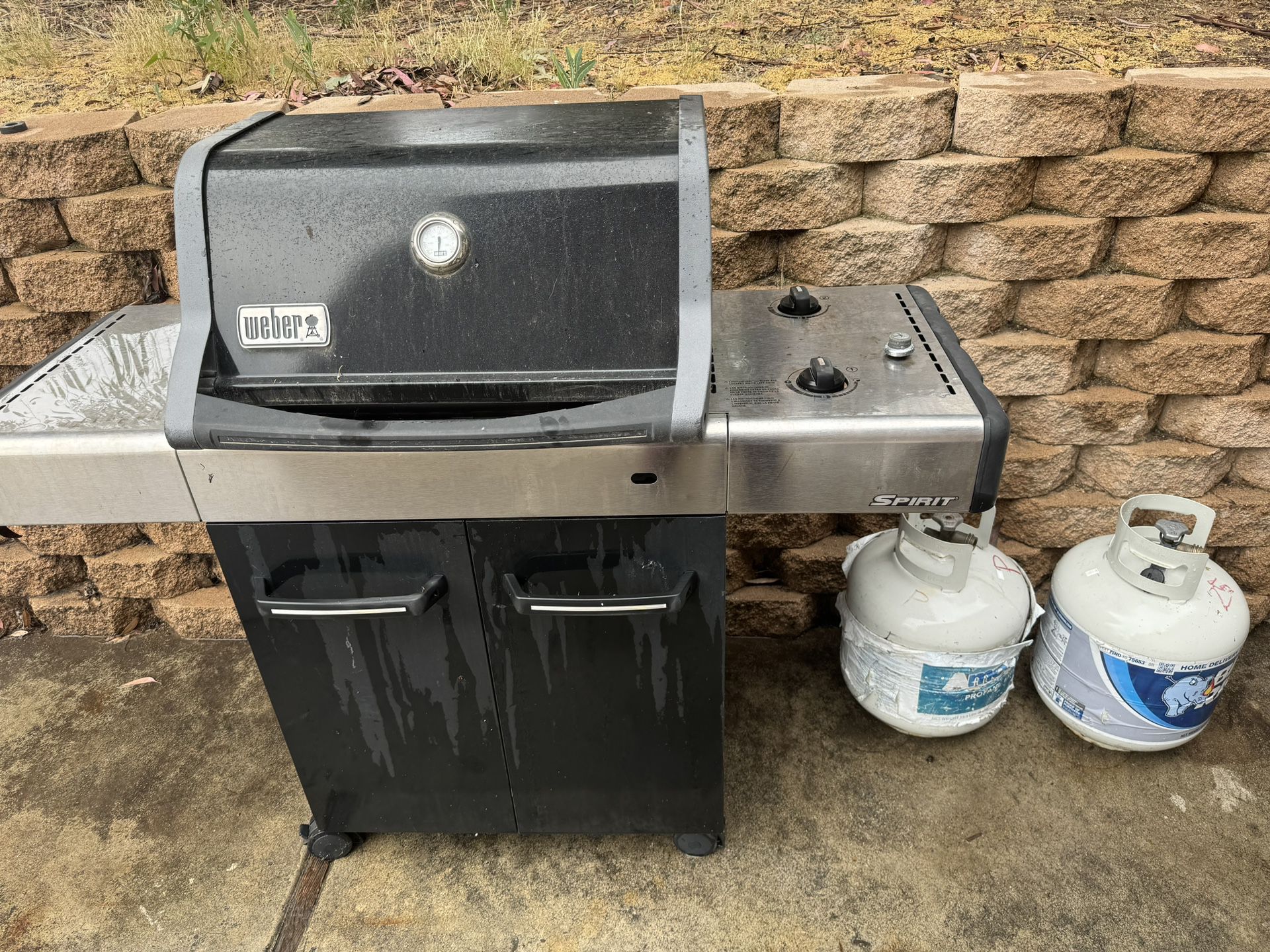 Weber Grill And 2 Propane Tanks 