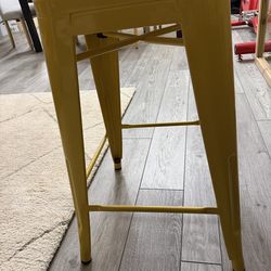24 in. Yellow Metal Bar Stool used