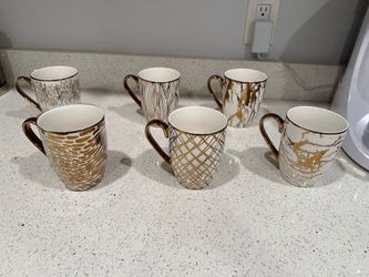 Gold and white mugs