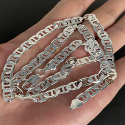 Shiny silver chain. Mariner link style. Has a 925 stamp on the clasp. Looks great on its own or layered.60cm ,24 inches