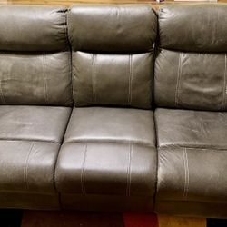 Faux leather adjustable reclining sofa in gray color