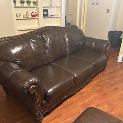 Beautiful dark brown leather sofa and loveseat set by Ashley Furniture
