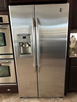 GE Profile  Stainless Steel Modern Side-by-side Refrigerator with Ice & Water Dispenser